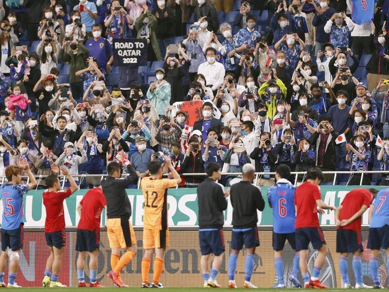 Japan players thank fans for their support after defeating Australia 2-1 at Saitama Stadium.