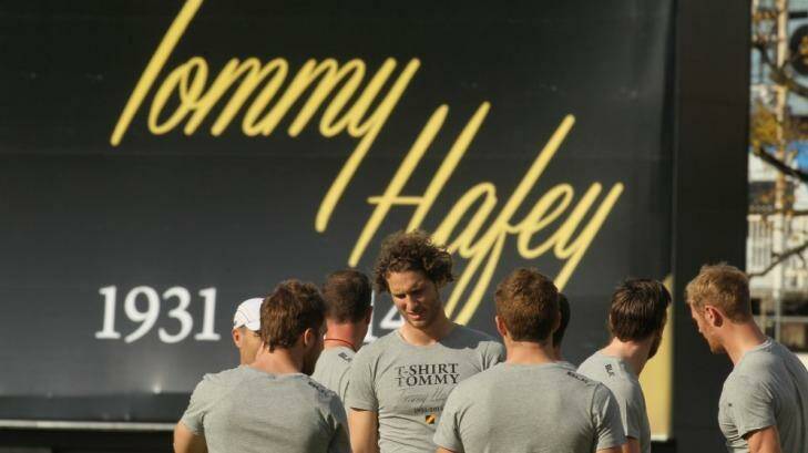 Richmond players at training at Punt Road on Friday, with a tribute to Hafey in the background.  Photo: Ken Irwin