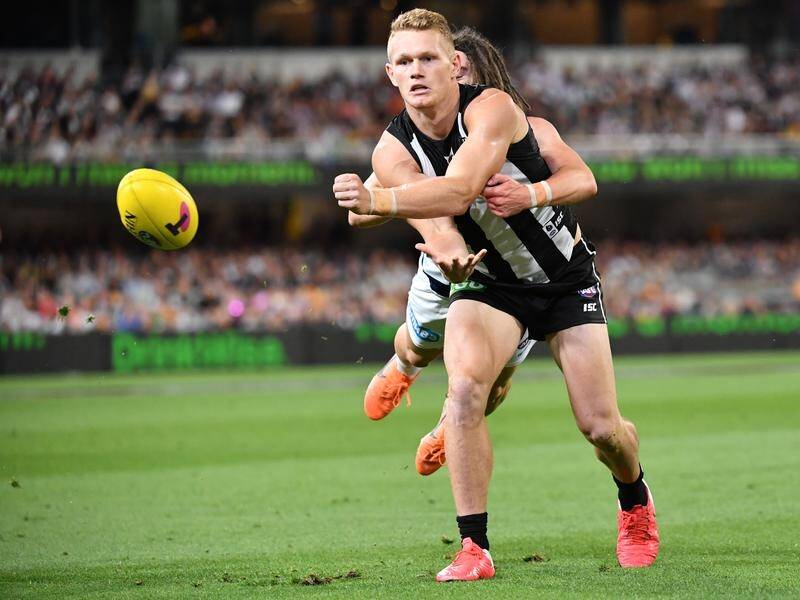 Adam Treloar was traded to the Western Bulldogs, one of four Collingwood players moved on.