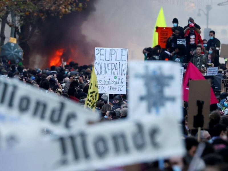 Thousands have marched in France to protest draft laws that some say limit press freedom.