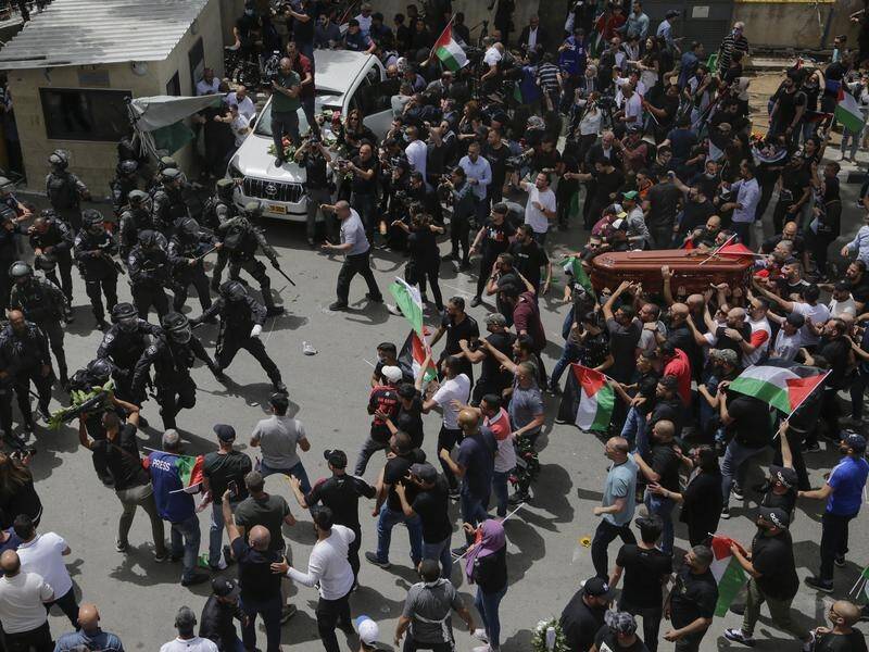 Israeli police confronted mourners as they carried the casket of slain reporter Shireen Abu Akleh.