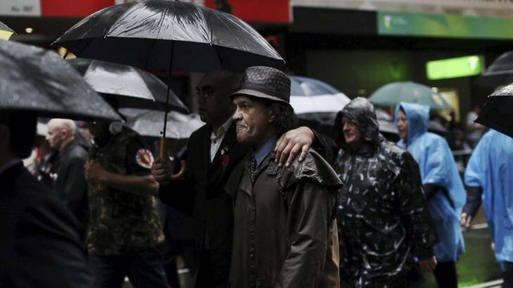 Veterans march in a wet Anzac Day parade. Photo: Nick Moir
