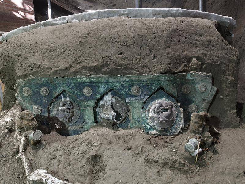 An intact ceremonial chariot with bronze decorations has been discovered near Pompeii.