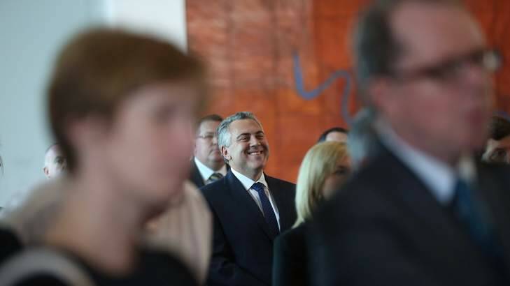 Treasurer Joe Hockey laughs as Prime Minister Tony Abbott launches "Triumph and Demise". Photo: Andrew Meares
