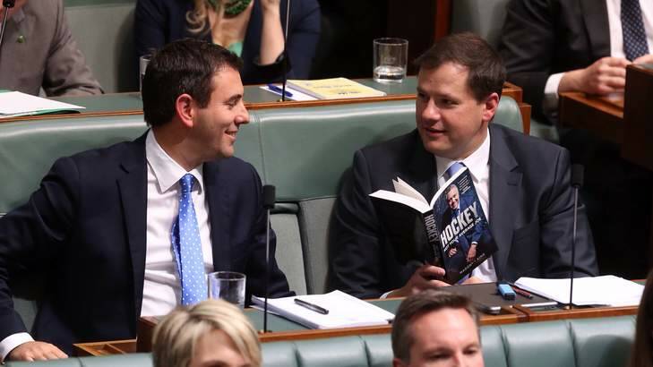 Ed Husic consults Treasuer Joe Hockey's book during question time. Photo: Andrew Meares