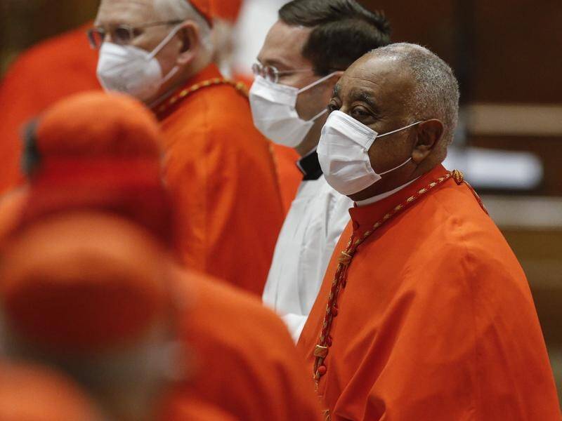 Wilton Gregory has become the first African-American cardinal in a scaled-down Vatican ceremony.