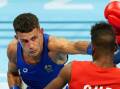 Harry Garside is one of 13 Australian boxers within a fight of earning an Olympic quota spot. (Martin Rickett/AAP PHOTOS)