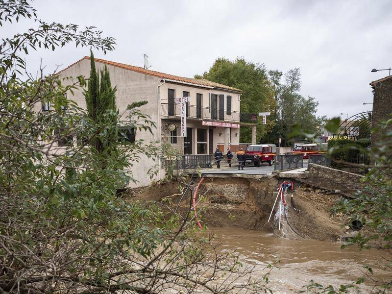 A collapsed bridge after flash floods in the town of Villegailhenc, southern France.