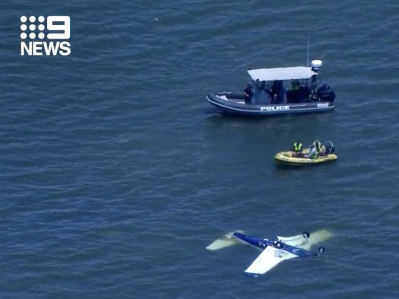A small airplane crashed into waters off Redcliffe, northeast of Brisbane, killing four people.