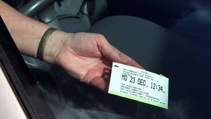 Jeanette Fitzsimmons from Warrnambool holds onto her parking ticket that blew off the dashboard of her car.  Photo: Leanne Pickett
