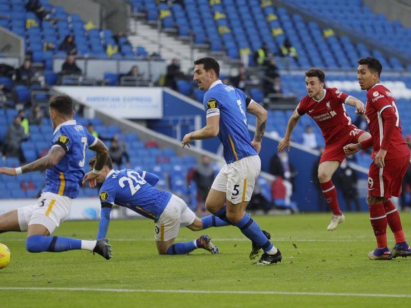 Diogo Jota (second right) fires home Liverpool's goal in the 1-1 Premier League draw at Brighton.