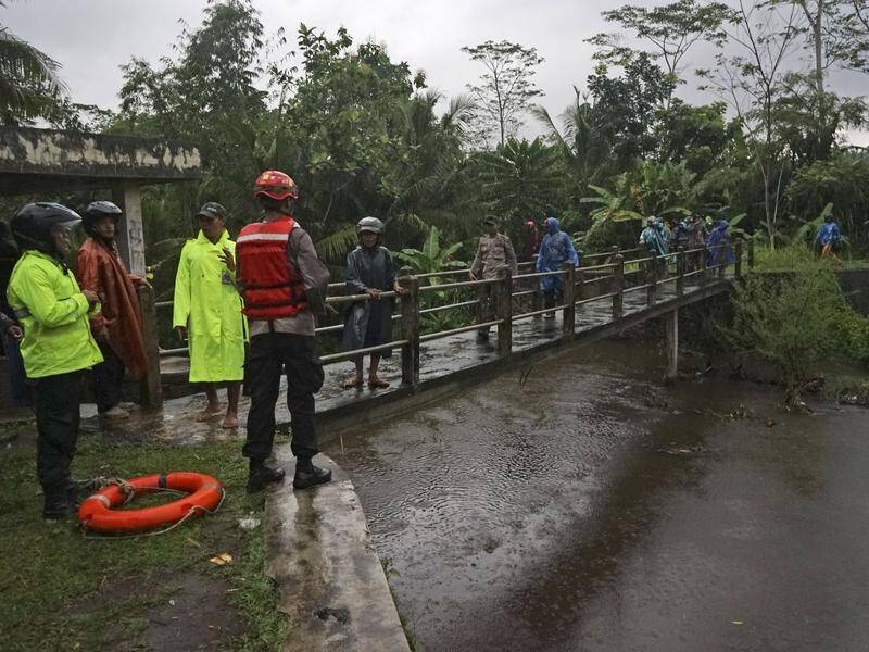 A flash flood has killed seven students on a river bank in Indonesia's central Java island.