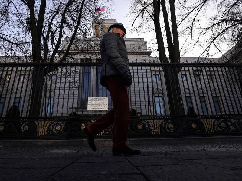 Germany has expelled two Russian embassy staff over Moscow's refusal to help with a murder probe.
