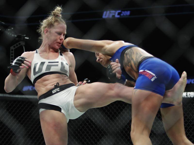 Former UFC women's bantamweight title holder Holly Holm will take on A...