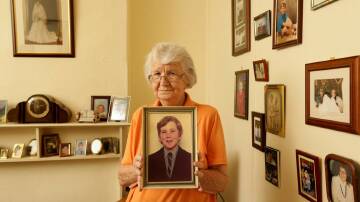 BEREFT: Audrey Nash, with a photo of her son, Andrew, who took his own life at their Hamilton home in 1974, aged 13, after being abused by convicted paedophile Vincent Ryan. Picture: Max Mason-Hubers