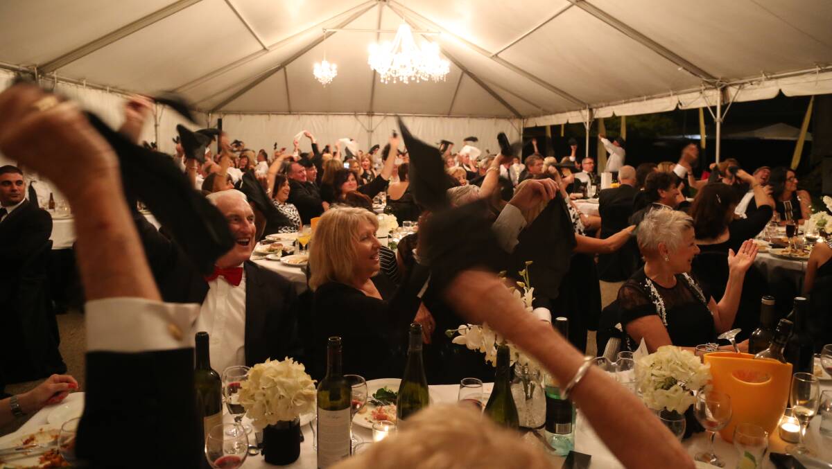 Attendees at the Twilight Dinner get involved in the entertainment. Picture: Anthony Stipo