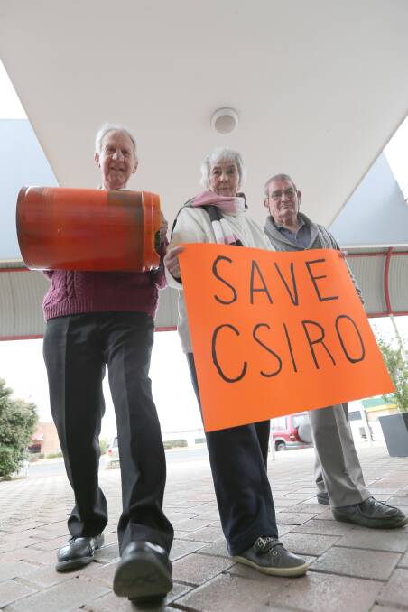 SAVE CSIRO: Brian Mills, Jean McClung and Peter Katsoolis will march every Wednesday in Griffith in an effort to have the decision to close the city's CSIRO reversed. Picture: Anthony Stipo