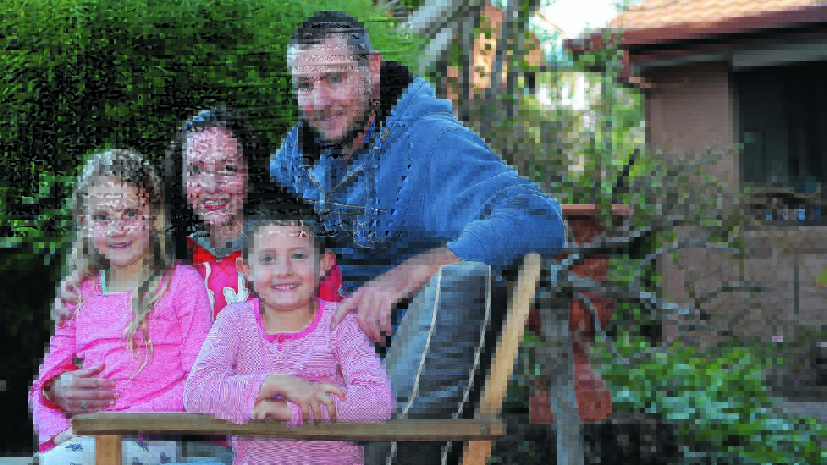 LAST RESORT: Fiona Buckland is pictured, with her husband James and children Ailya, 8 and Huon, 5. She will fly out to Germany next Monday to have treatment for Lyme Disease. 	Picture: Anthony Stipo 