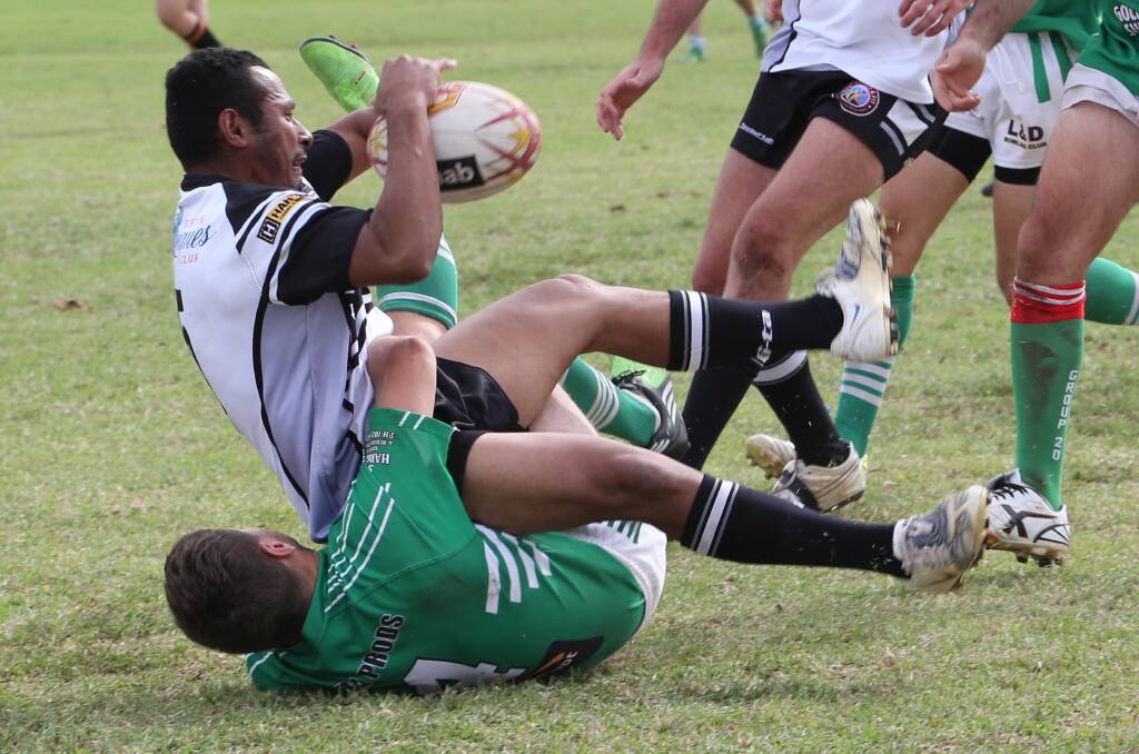 WRAPPED UP: Griffith's Peni Baleinausori is tackled by a Leeton player in Sunday's Paul Kelly Memorial Shield clash.