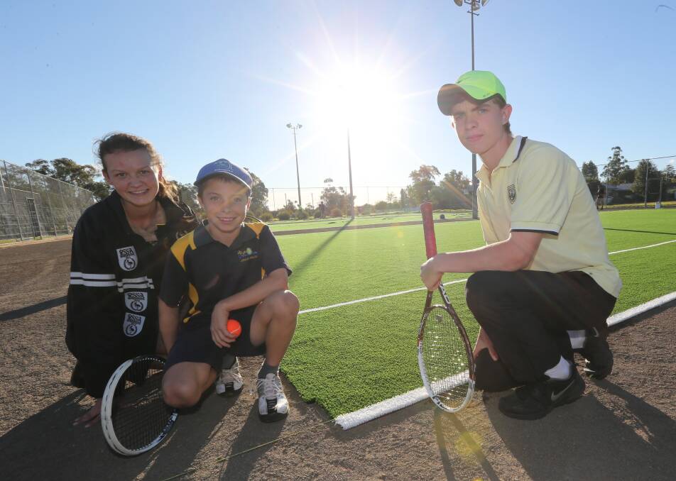 GRASS IS GREENER: Alison Triggs, 13, Ben Mahlknecht, 11 and Jaidyn Dickie, 15, admire the new surfaces that were laid this week at the Griffith Tennis Club's Jack Shannon complex. Picture: Anthony Stipo