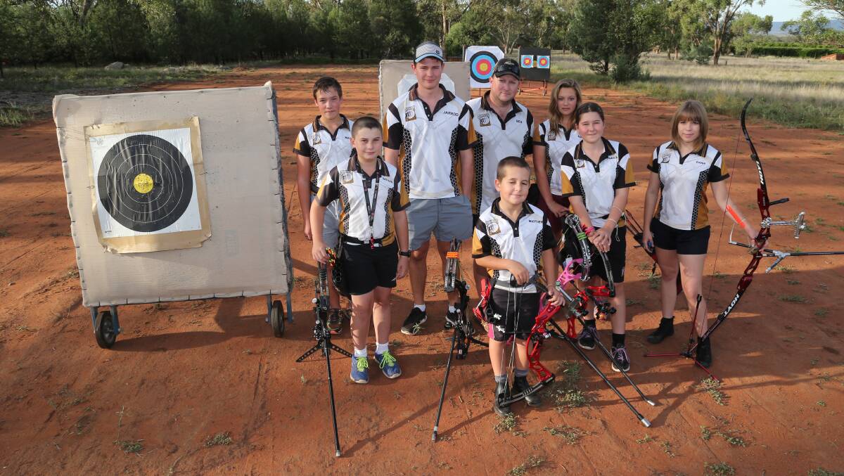 GOING FOR GOLD: The Griffith City Archers head to Adelaide today for the Junior National Archery Championships. Representing the ACT are (back, from left) Lawrence Salvestro, Jarrod Rossiter, coach Ben Pawson, Maddie Salvestro, (front) Nathan Rowley, Matthew Pawson, Emily Ruskin and Dana Biondo. Picture: Anthony Stipo