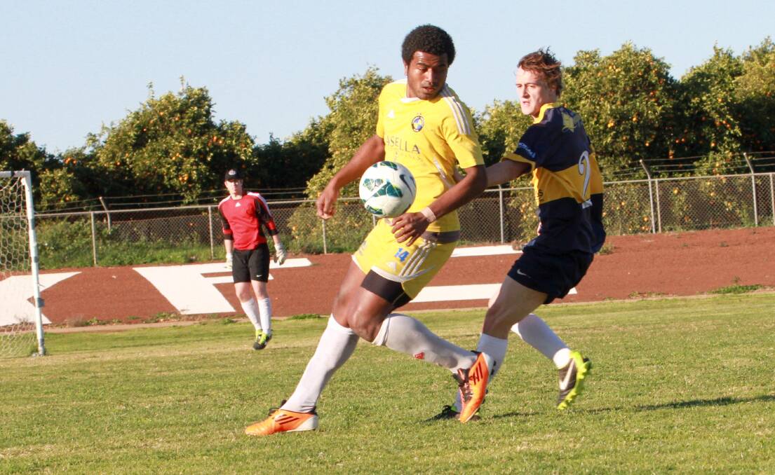 WATCH YOUR BACK: YFC's Archie Watkins looks to turn the corner as YSC's Hudson Fanani tracks his run in last year's Yoogali derby. The two clubs will lock horns on Sunday at EW Moore Oval with top spot on the line. Picture: Anthony Stipo