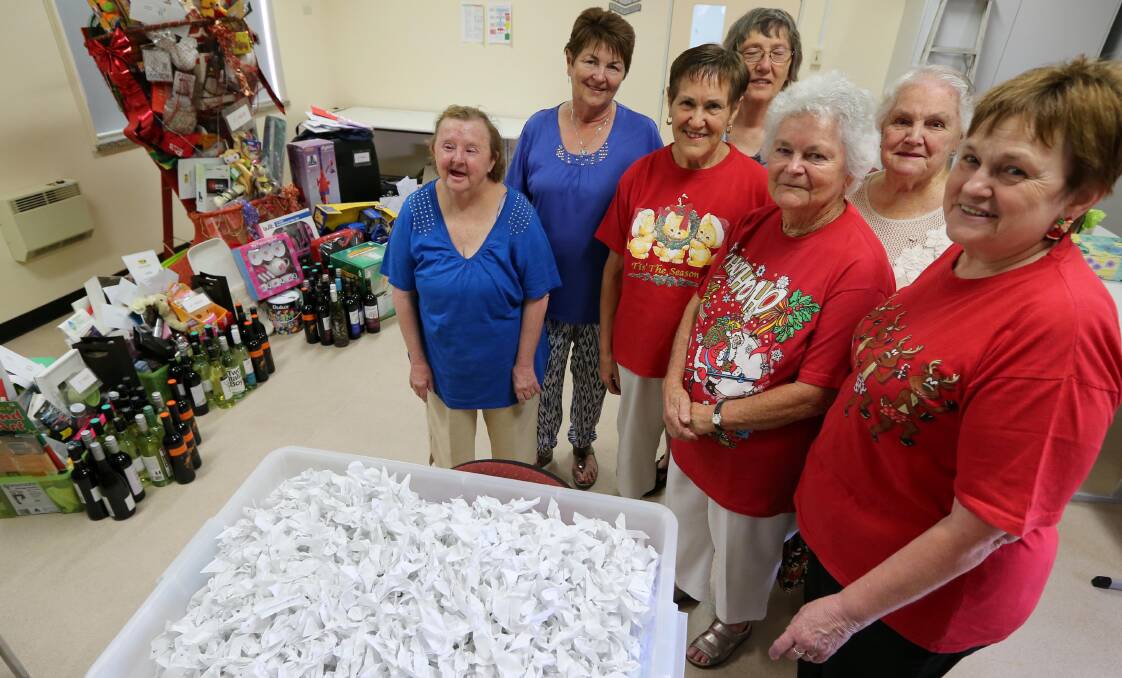 JUST THE TICKET: Griffith Base Hospital Auxiliary members Gwen Black, Carol Young, Ruth Taylor, Ada Snaidero, Heather Eagleton, Sheila Crump and Louisa Feltracco draw the winners of the annual Christmas stocking. Picture: Anthony Stipo