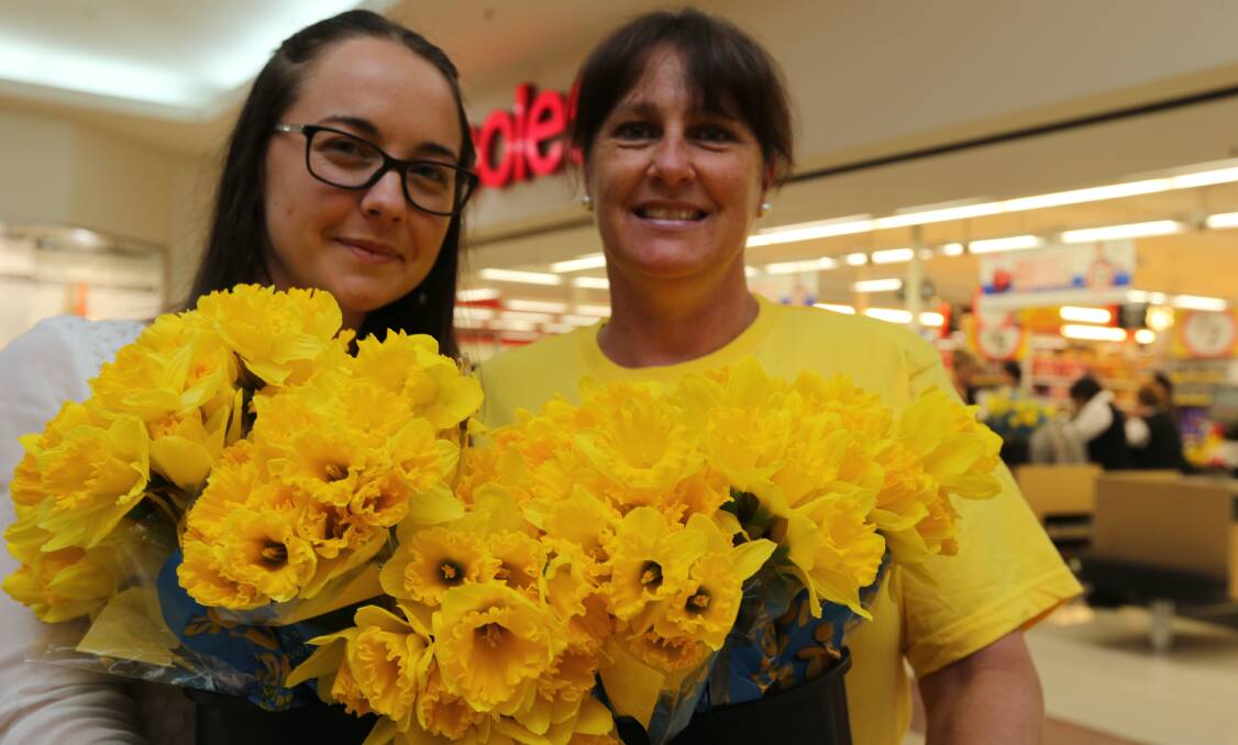 HOPE GROWS: Cancer Council volunteer Janet Harrington and Griffin Plaza centre manager Rachael Best hope locals will buy a daffodil this Daffodil Day to help grow hope for cancer patients.
