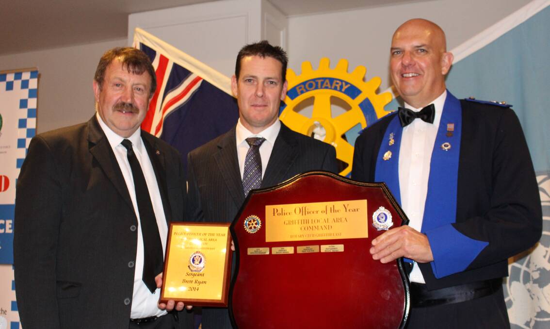 Sergeant Brett Ryan (middle, pictures with Rotary's Denis Conroy and Local Area Commander Detective Superintendent Michael Rowan) has been named Police Officer of the Year.