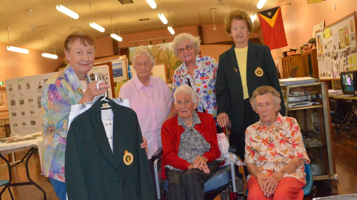 ICONIC DONATION: Former secretary of the NSW branch of the Australian Women’s Land Army Margaret Messer hands over a Women’s Land Army uniform to Griffith veterans (back) Lola Smellie, Esme Wirth and Kath Savage (front) Gwen Chilvers and June Gulloni.