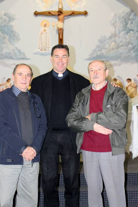 PLANS IN PLACE: Bruno Guidolin, Father Andrew Grace and Father Beltrame's brother Tiziano Beltrame discuss bringing Father Beltrame back to Griffith. Picture: Tanya Pattison.