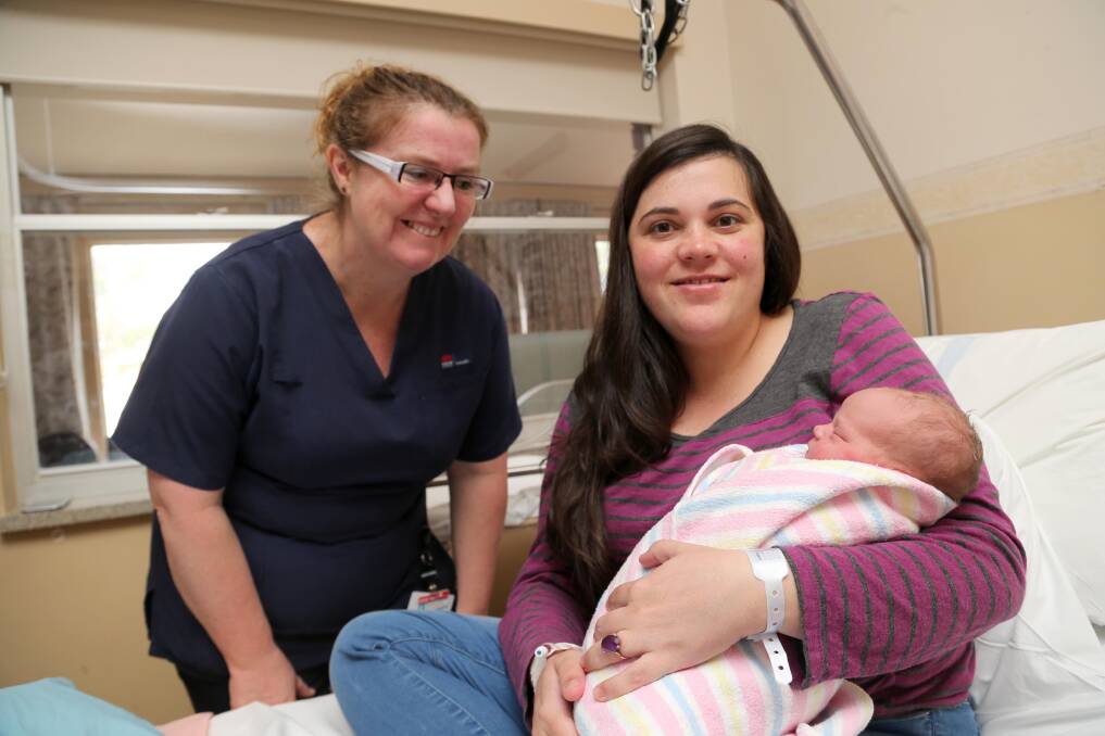 Midwifery unit manager Angela Cregan with Amanda Avery and her newborn daughter who is the first baby born in the newly renovated birthing room at the Griffith Base Hospital maternity ward.