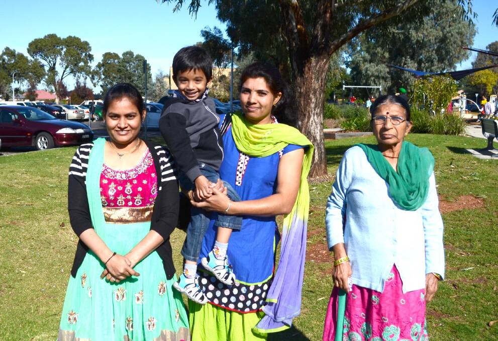 A FAMILY AFFAIR: Shipla Patel, Sumitra Patel, Siddh Patel, 3, and Dayben Patel enjoy the activities and food on offer at the Shaheedi Memorial Tournament.