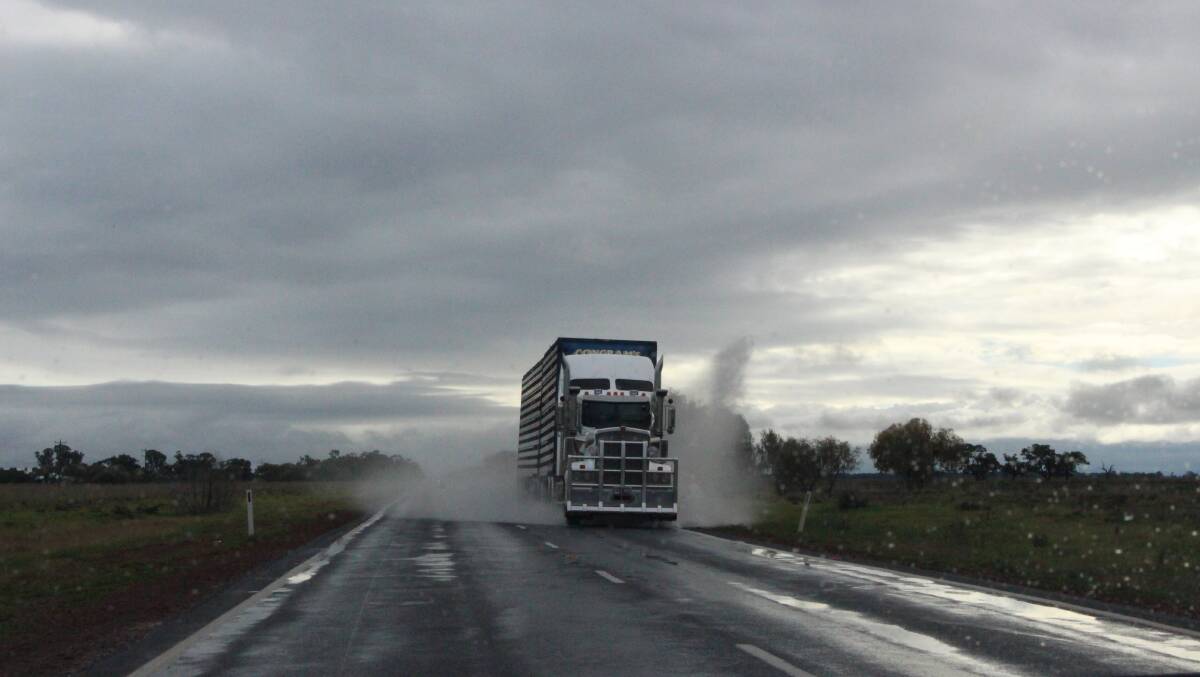 WINTER ARRIVES: A truck drives through a puddle between Griffith and Darlington Point yesterday.