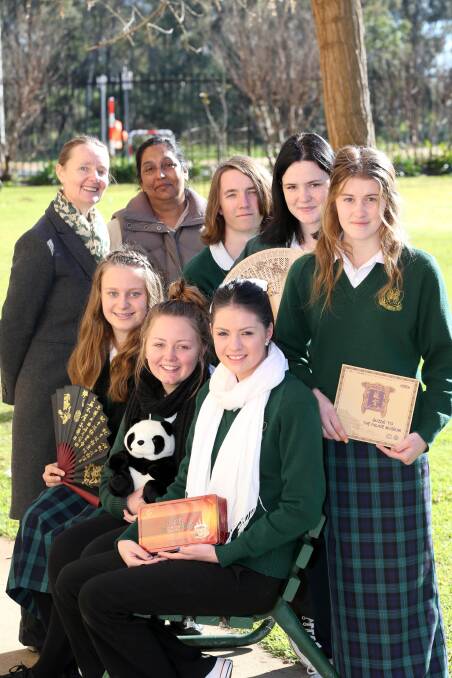 WELL TRAVELLED: Some of the Griffith High School students and staff (back) Justine MacCormick, Jyotika Maharaj, Callum Christen, Brianna Culgan, Emma Dreyer (front) Codeigh Ayling, Briarna Taylor and Anjelica Diaz-Forrester, who enjoyed an excursion to China.
Picture: Anthony Stipo.