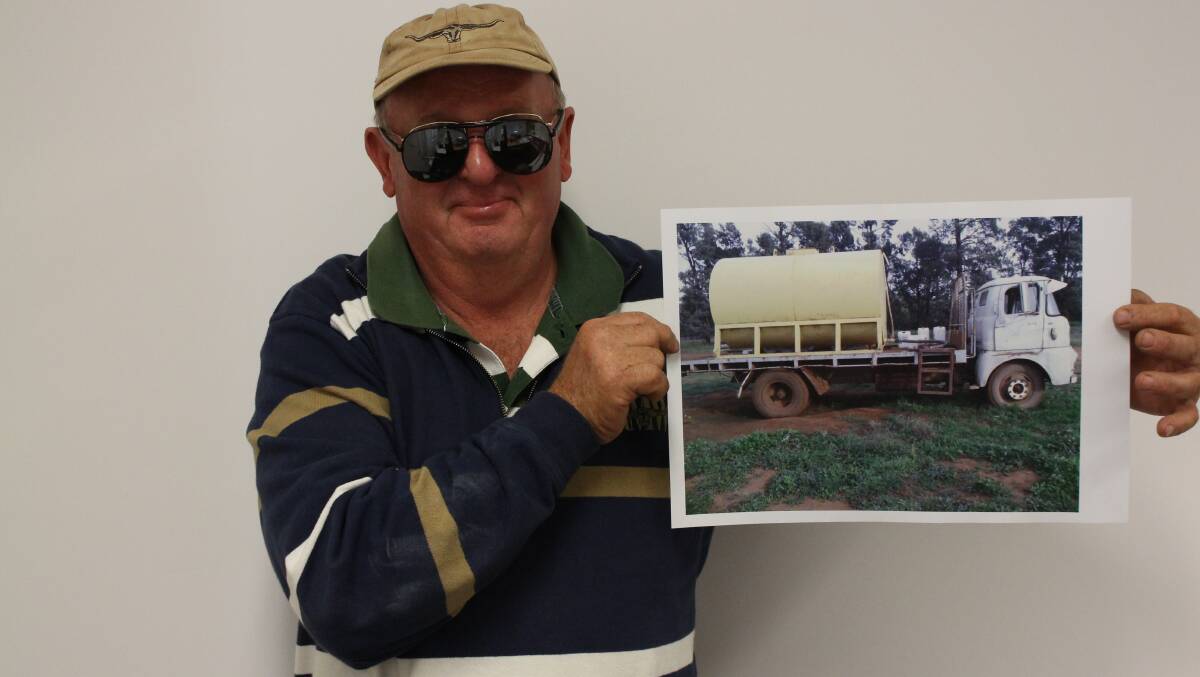 Ray Gullifer with a photo of the truck.