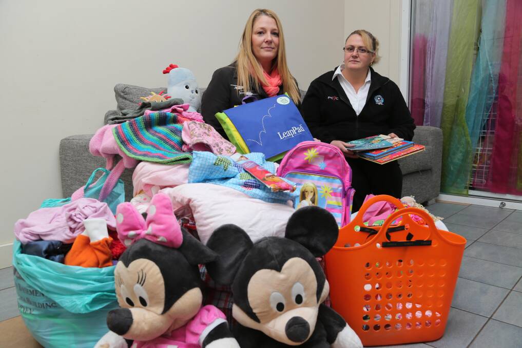 Helping hands: Sheradine Turkington and Kym Neal are urging locals to help out Deanne McDermott Hadrill, who lost everything in a fire last week.