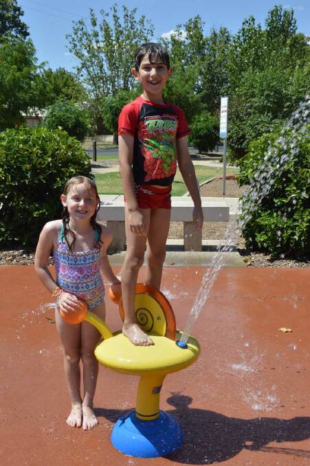 Chloe Evans, 7, and Julian Marcanio, 8, at City Park in Griffith. Picture: Leah Humphrys