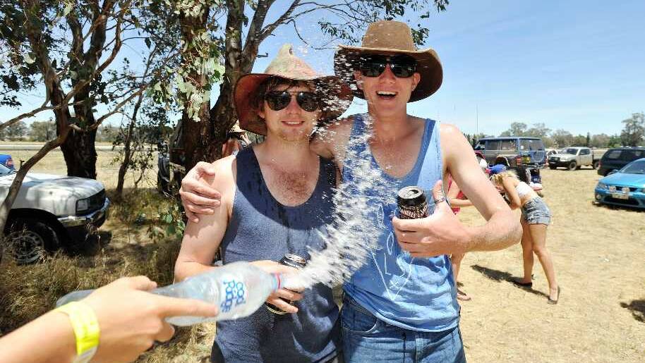 Alastair Mansfield and Dan Holden cool off at the Holbrook B&S car park. Picture: Alastair Brook