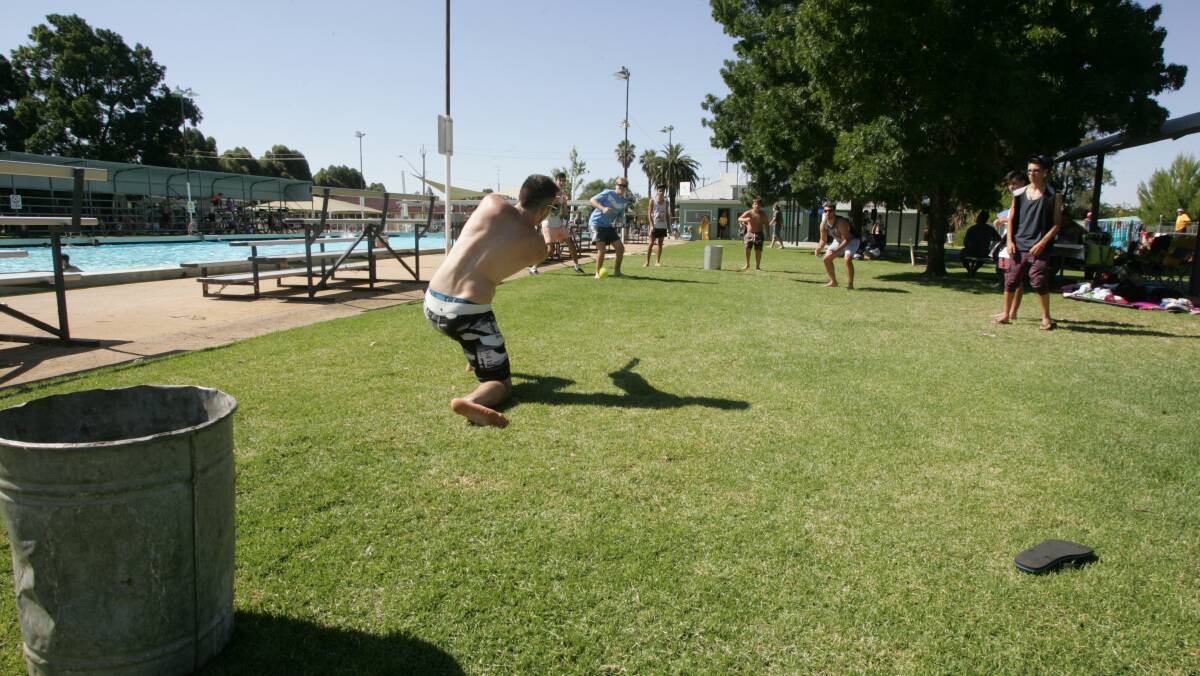 Backyard cricket at the Australia Day pool party in Leeton. Picture: John Gray