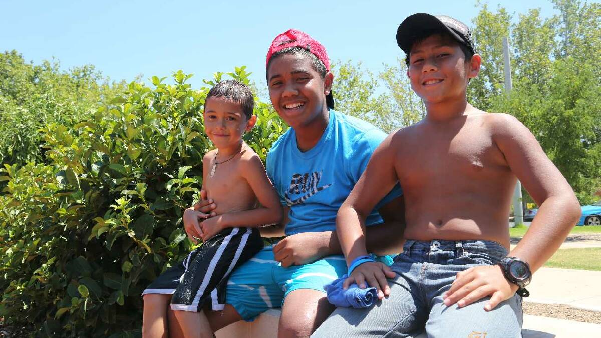 Jye Eslick, 6, Jaulian Marela, 14, and Reni Marela, 12, at City Park in Griffith. Picture: Anthony Stipo