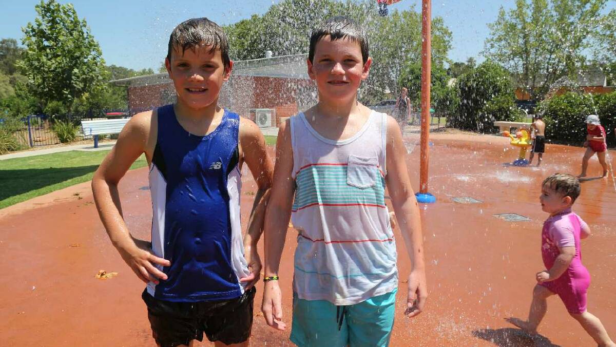 Oliver Bartter and Riley Piva, both 9, at City Park in Griffith. Picture: Anthony Stipo