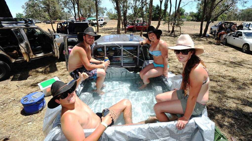Justin Brooke-Smith, Kieran Brooke-Smith, Elise Whitaker and Kate Whitaker in a very portable pool in the Holbrook B&S car park. Picture: Alastair Brook