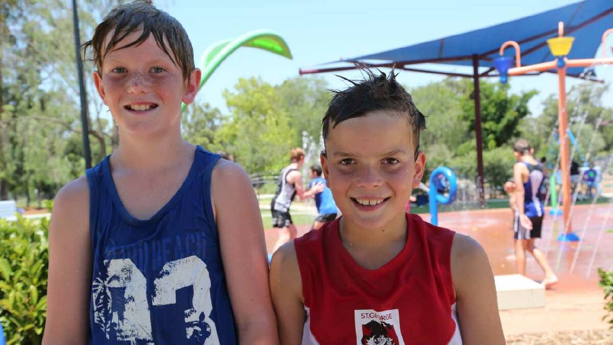 Isaac Piva, 9, and Tom Bartter at City Park in Griffith. Picture: Anthony Stipo