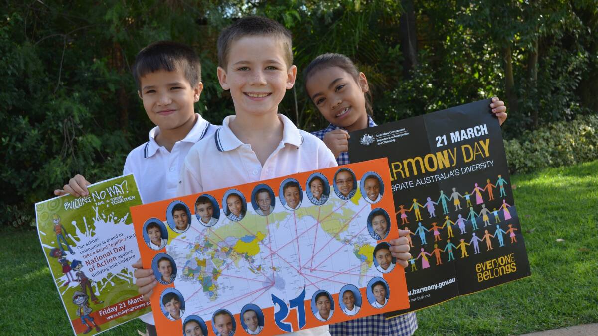 Griffith Public School students Zeshan Sadiqi, 7, Jye McIntyre, 7 and Rebecca Tupa, 7, get ready for the
school's combined Harmony Day and National Day of Action Against Bullying and Violence.