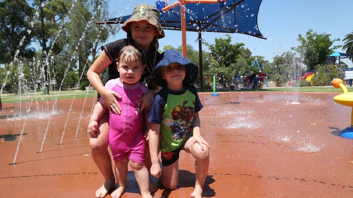 Sasha, 10, Tempi, 2, and Mitchell Halliburton, 5, at City Park in Griffith. Picture: Anthony Stipo
