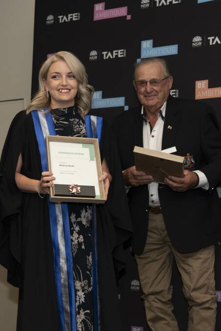 TAFE NSW Griffith health, wellbeing and community services student of the year Melissa Bratt with Griffith City Council mayor John Dal Broi. PHOTO: Contributed