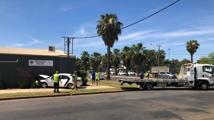 A Kia Cerato is recovered by tow truck following a collision on Jondaryan Avenue. PHOTO: Declan Rurenga