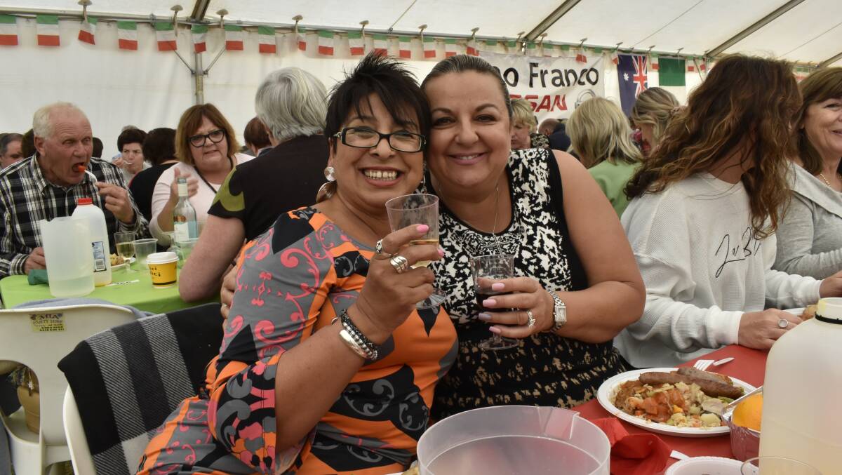 Bon Appétit: Dora Valois and Loredana Elmowy enjoy the delights of Griffith's Salami Festival in 2019. PHOTO: Kenji Sato