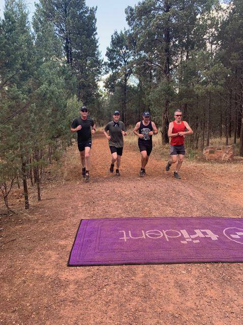 IN SYNC: New Years Day's 14-minute group, John Keenan, Moreno Chiappin, Derek Goullet and Peter Stockwell line up in formation to cross the finish line. PHOTO: Contributed